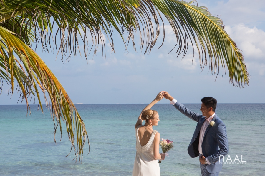bride and groom at Blue Venado beach Club by Naal Wedding Photography